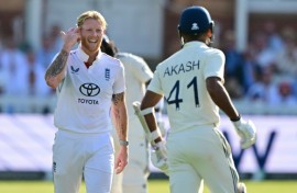 England captain Ben Stokes (L) gestures to India's Akash Deep