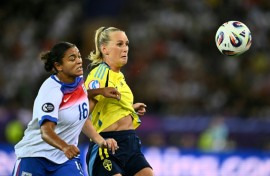 England defender Jess Carter (left) in action against Sweden at the Women's Euros