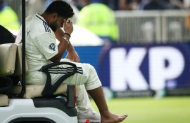 India's Rishabh Pant reacts as he leaves the field in a buggy after retiring hurt on 37 with a foot injury