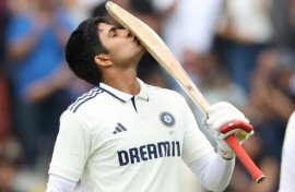 England captain Ben Stokes (C) celebrates with team-mates after dismissing India's KL Rahul in the fourth Test at Old Trafford
