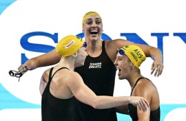 Australia celebrate winning the final of the women's 4x100m freestyle relay