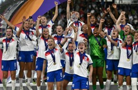 England players lift the trophy after beating Spain on penalties to win the Women's Euro 2025