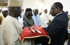 In 2019, France returned a 19-century sword to Senegal's then president Macky Sall (right)