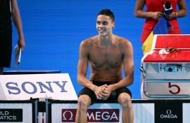 Romania's David Popovici completed a 100m-200m sprint double at swimming's world championships in Singapore
