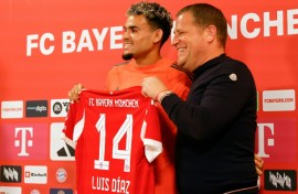 New Bayern Munich forward Luis Diaz (L) smiles alongside sporting director Max Eberl at his unveiling on Thursday.
