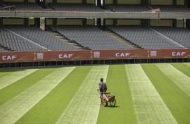 A groundkeeper puts the finishing touches to the pitch in Nairobi ahead of the African Nations Championship