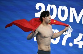 China's Qin Haiyang won the men's 200m breaststroke at the world championships in Singapore on Friday