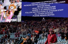 A public announcement warns of lightning during the third rugby Test match between Australia and the British and Irish Lions at Stadium Australia in Sydney