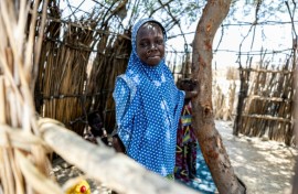 A young Chadian poses for a photograph at the Kiskra site for internally displaced people