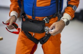 Raphael Domjan holds his oxygen cylinder as the Swiss adventurer prepares to get into the SolarStratos plane