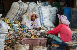 Women sorting through plastic waste in Pekanbaru, Indonesia
