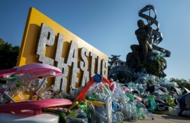 Canadian artist Benjamin Von Wong's sculpture 'The Thinker's Burden', sited outside the UN, is being slowly covered in plastic during the treaty talks in Geneva