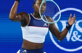 Frustrated Coco Gauff tosses her racquet during her quarter-final loss to Jasmine Paolini at the ATP-WTA Cincinnati Open