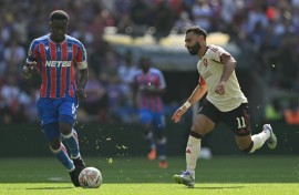 Crystal Palace star Marc Guehi (L) says living with his parents and sisters is the perfect balance to his high pressure career