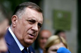 The Bosnian Serb president, Milorad Dodik, is defying a ban on him staying in office, and seeking public support to stay in power