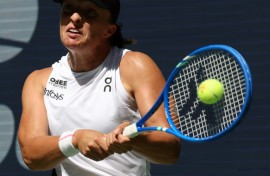 Poland's Iga Swiatek blasts a return to Emiliana Arango in a straight sets first round win at the US Open