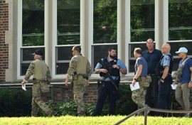 Law enforcement officers at the scene of the shooting at Annunciation Catholic School in Minneapolis, Minneosta