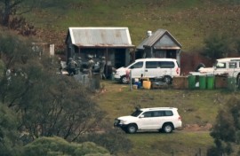 Australian police searched buildings for a gunman suspected of killing two officers