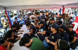 Thousands line up to join the civilian militia in Venezuela after President Nicolas Maduro warned of possible US invasion
