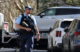 A tow truck removes a car after it was driven into the gates of the Russian consulate in Sydney on September 1, 2025