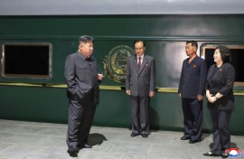 This picture taken on September 1, 2025 and released from North Korea's official Korean Central News Agency via KNS shows Kim outside his train