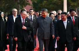 Russia's President Vladimir Putin walks with China's President Xi Jinping and North Korea's leader Kim Jong Un before a military parade marking the 80th anniversary of victory over Japan and the end of World War II, in Beijing’s Tiananmen Square