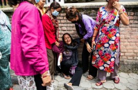 Relatives of victims waited outside a hospital in Kathmandu to receive their bodies