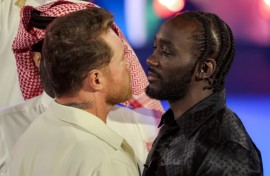 American boxer Terence Crawford, right, faces off against Mexico's Canelo Alvarez, left, ahead of their super middleweight title fight