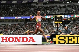 Kenya's Beatrice Chebet celebrates after winning the world 10,000m title