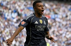 Real Madrid's French forward Kylian Mbappe celebrates scoring his team's first goal against Real Sociedad