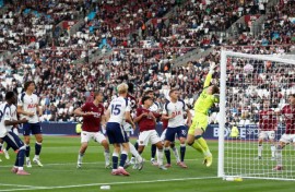 Pape Matar Sarr (L) scores for Tottenham Hotspur against West Ham United.