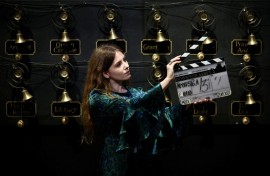 A clapper board used in the production of the film 'Downton Abbey: A New Era', in front of the 'bell wall'