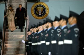 US President Donald Trump and US First Lady Melania Trump disembark from Air Force One at the start of the state visit