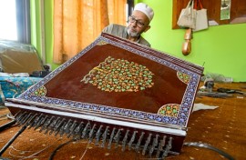 Generations of artisans in Indian-administered Kashmir have been making musical instruments such as the santoor, a zither-like, hundred-stringed instrument