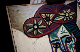 The painting is in a simple wooden frame
