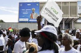 A billboard of Guinea President Mamady Doumbouya is seen during a "yes" vote rally at the People's Palace in Conakry on September 18, 2025