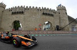 Lando Norris negotiates the Baku street circuit in practice for the Azerbaijan Grand Prix