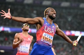 USA's Noah Lyles crosses the finish line to win the men's 4x100m relay final
