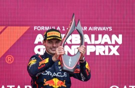 Max Verstappen collects his trophy in Baku