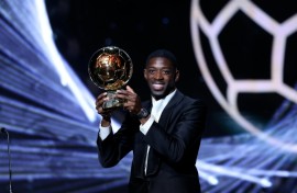 Paris Saint-Germain's Ousmane Dembele with the trophy after winning the men's Ballon d'Or on Monday