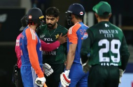 Pakistan's Haris Rauf (3R) shares words with India's Abhishek Sharma (L) during his side's Super Four loss to India on September 21