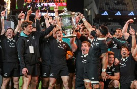 New Zealand celebrate with the Bledisloe Cup after beating Australia at Eden Park in Auckland