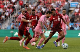 Inter Miami's Lionel Messi attempts to evade Toronto's Kosi Thompson in their 1-1 draw in Major League Soccer