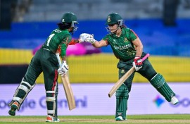 Bangladesh's Rubya Haider (R) and Nigar Sultana en route to leading their side to a comfortable opening win