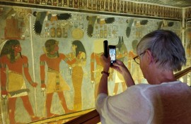 A tourist visits the tomb of Pharaoh Amenhotep III in the Valley of the Kings after the site was opened to the public