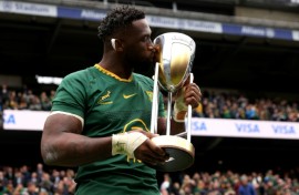 South Africa captain Siya Kolisi kisses the Rugby Championship trophy following a 29-27 win over Argentina at Twickenham that clinched the title