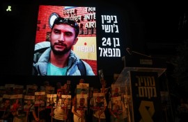 A picture of Nepalese national Bipin Joshi held hostage by Palestinian militants in Gaza since 2023, is displayed on a screen during a demonstration organised by the families of hostages calling for action to secure their release in Tel Aviv on August 16, 2025