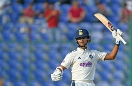 India's Yashasvi Jaiswal celebrates after scoring 150 runs