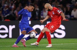 France forward Kylian Mbappe (L) and Azerbaijan defender Elvin Badalov (R) fight for the ball during the FIFA World Cup 2026 Group D qualifier at the Parc des Princes