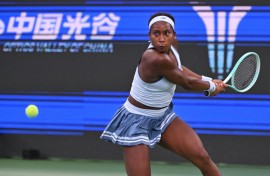 Coco Gauff hits a return to Italy’s Jasmine Paolini